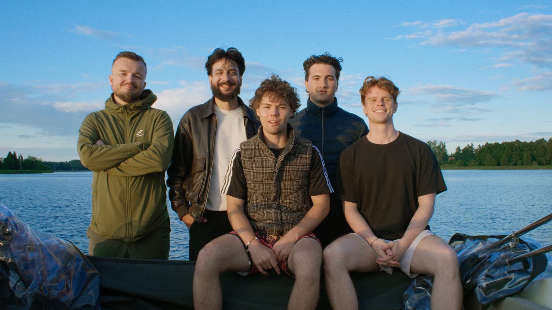 Five members of the Boski team together by a lake.