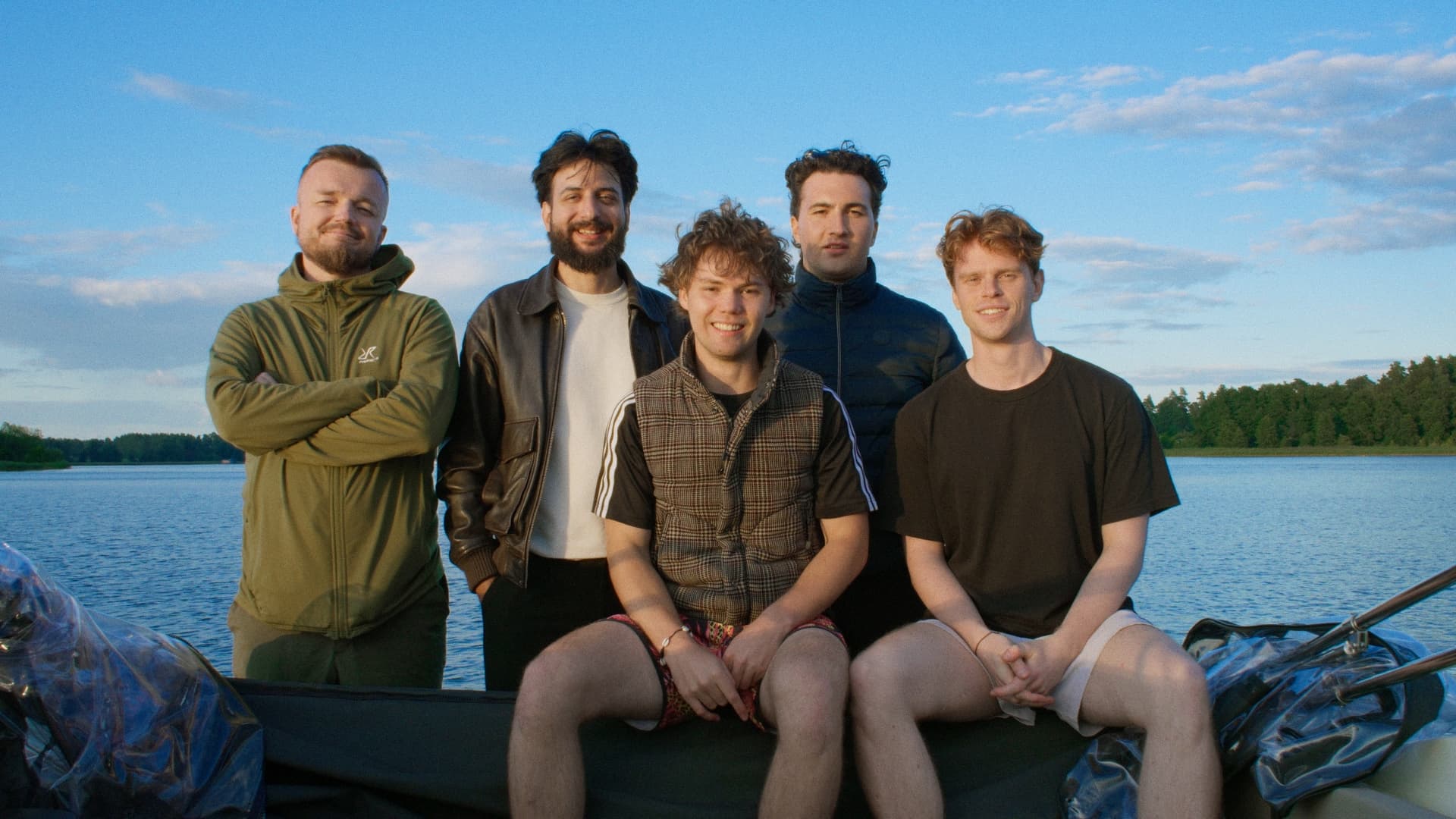 The Boski team together on a boat by the lake