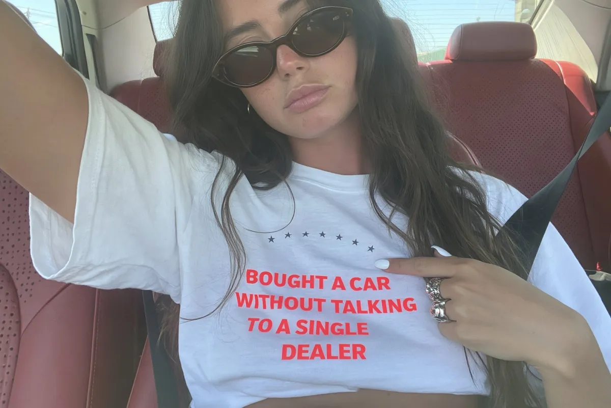Car selfie, tee reads: "Bought a car without talking to a single dealer"